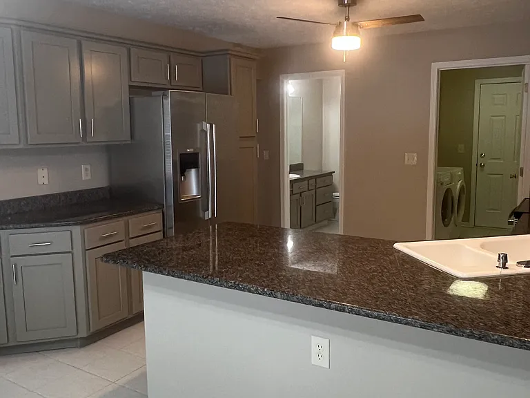 Kitchen with NEW cupboards and appliances. Granite countertops.