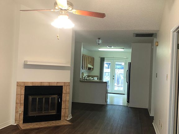 Spacious open vaulted living room, dining room and kitchen. New paint, new floors!