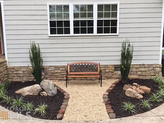 The perfect little courtyard for bird watching in the mature hardwood forest buffer.