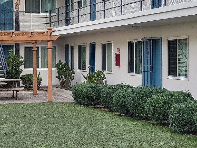 Sitting area in courtyard at center of Orland Woods Apartments in El Cajon, California.