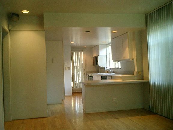 Kitchen with built-in eating area and stereo cabinet
