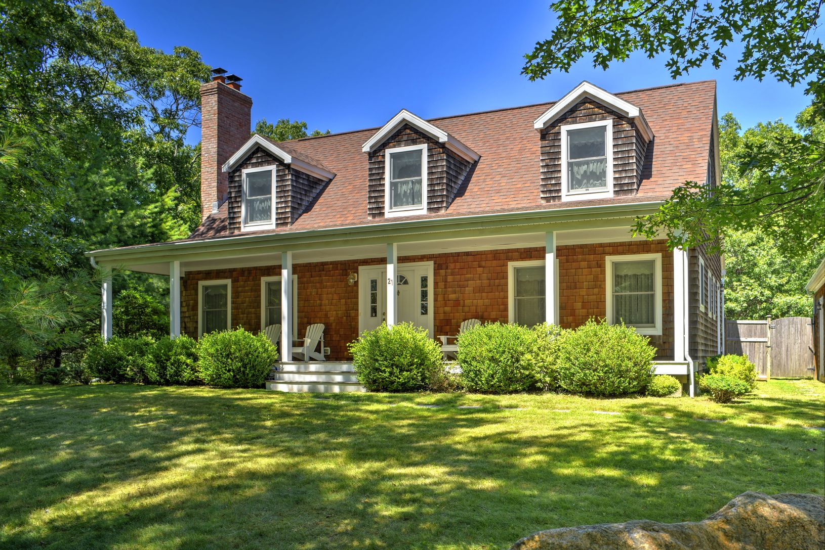  Beautiful Cape Cod home with expansive front porch
