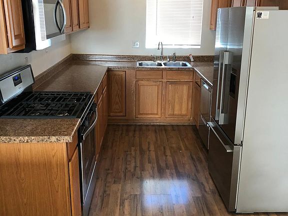 Galley style kitchen with new stainless steal oven and oven