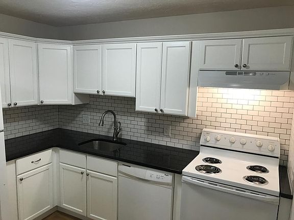 Updated kitchen with granite countertop.