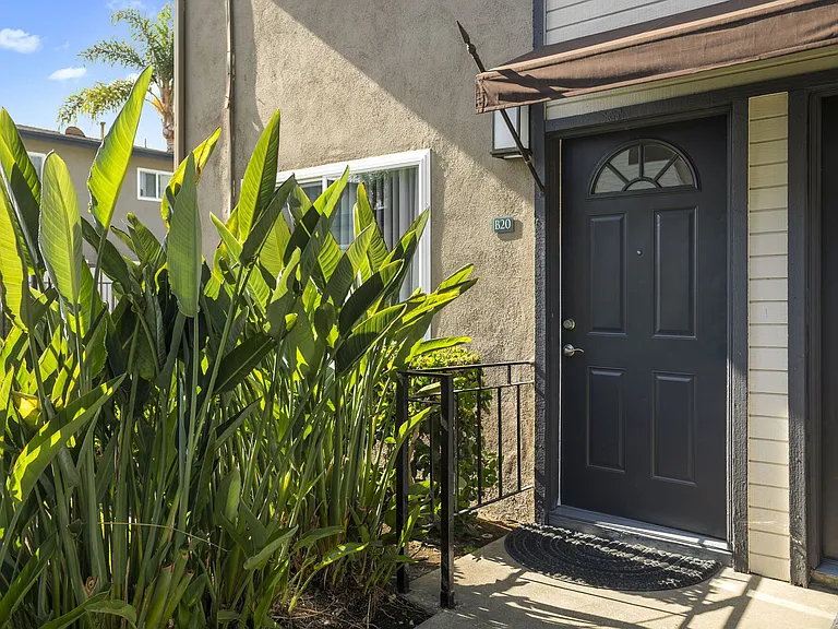 Apartment front door at Olive Tree Townhomes in Costa Mesa, CA