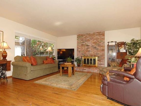 LR w/ wood fireplace.
