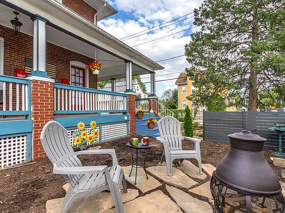 Outdoor space with chiminea and fence for privacy from street