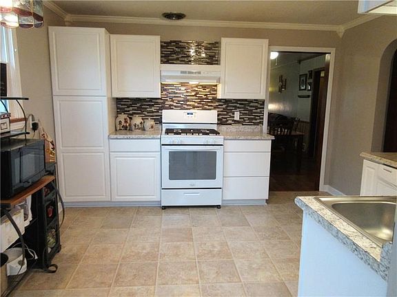 There is plenty of cabinet space and lighting in this gorgeous kitchen!