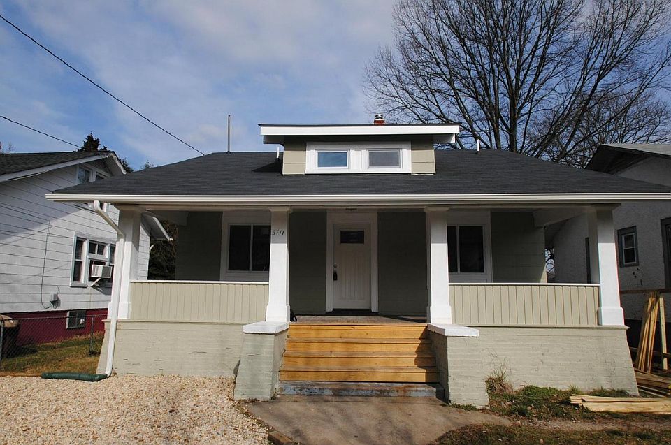 Front of home has a big front porch that has just been sanded and stained.