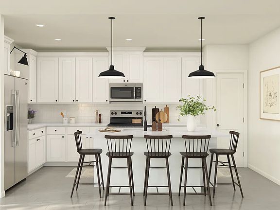 Kitchen with pendant lights over island