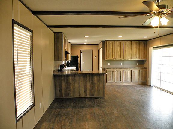 Hall looking to kitchen and dining room