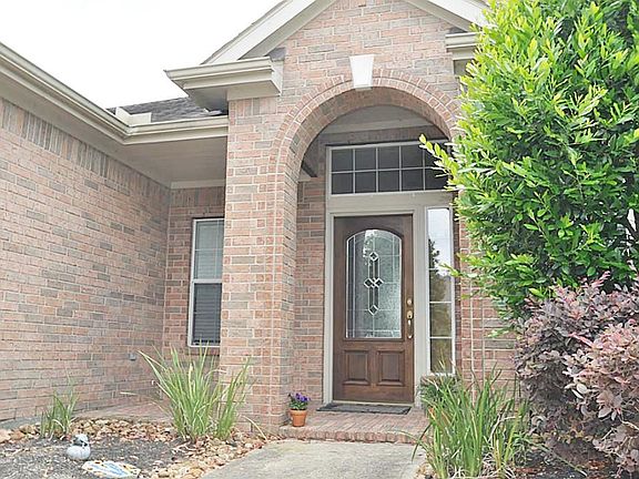  Covered front patio . Front door with beautiful glass
