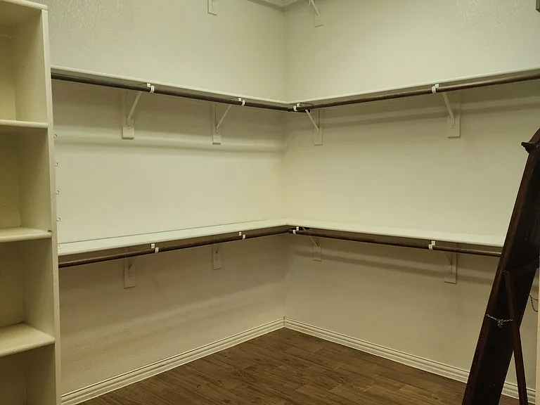 half of master bedroom closet