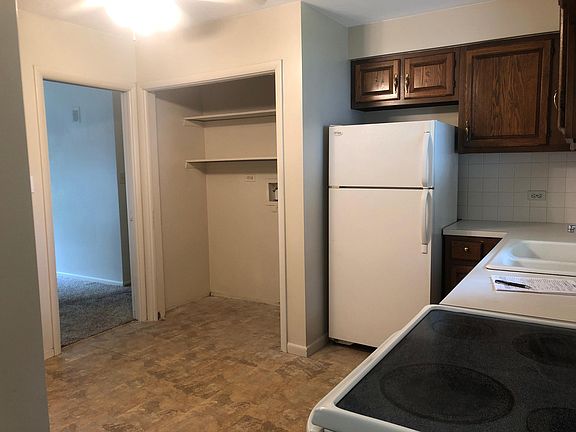Kitchen with laundry closet. Stove and refrigerator included.