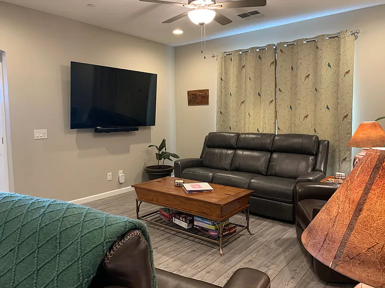 Many of our previous short term guests have mentioned that their favorite features of our property is the very comfortable all leather living room set with automated recline.