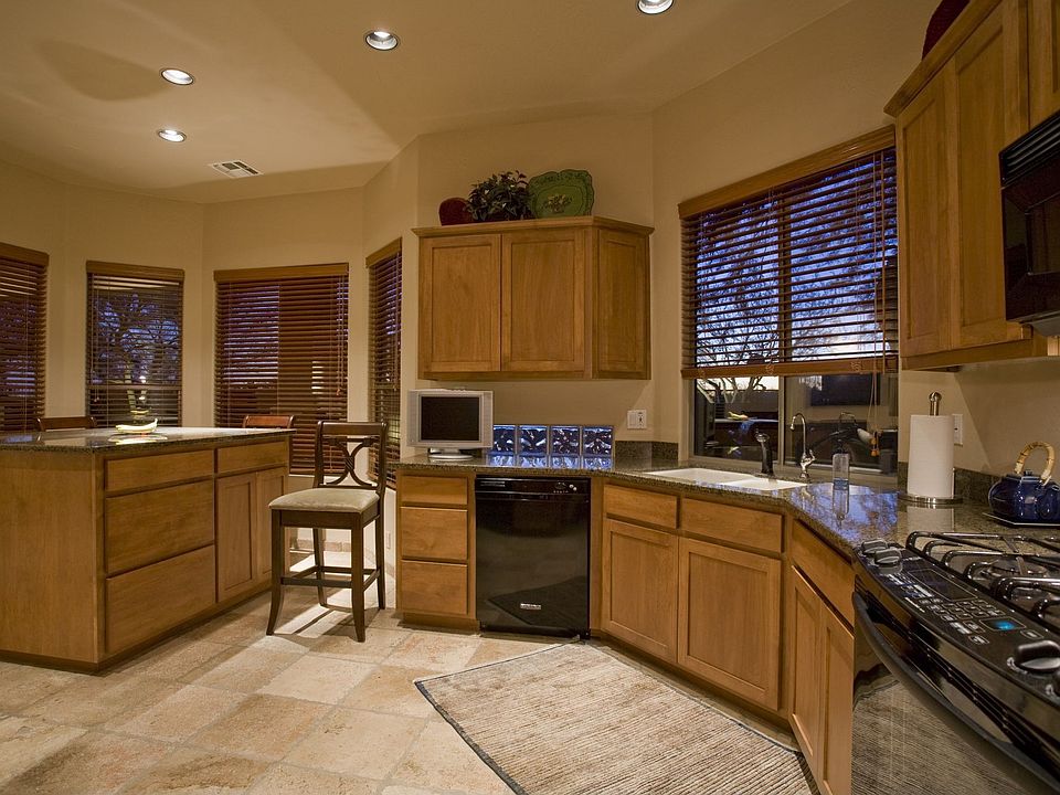 Alder Cabinets and slab granite in kitchen