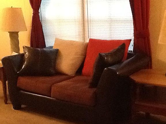 Very nice furniture located in this cozy home.