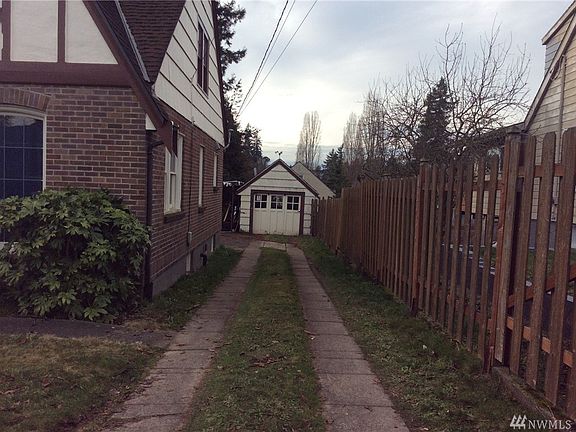 Detached garage in back with with gated circular driveway