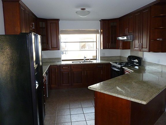 Kitchen with Breakfast Bar and Garden Window