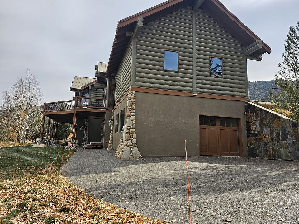 Showing the entry area for guests to this Craftsman log home. Upper deck shown is for home owners.