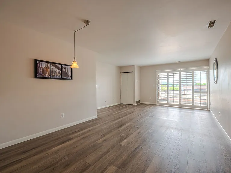 living room and dining room view looking in from the entrance door
