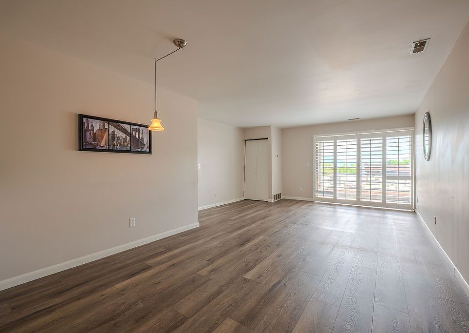 living room and dining room view looking in from the entrance door