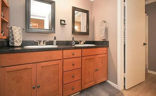 2-sink powder room leading into the full bathroom on the second floor