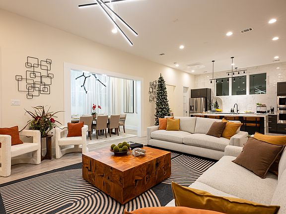 A spacious living room. Open to the dining room, office, and kitchen