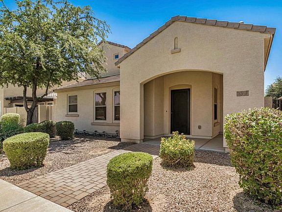 Entrance across from open grass area, all landscape HOA maintained