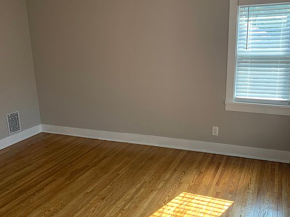 Refinished hardwood floors in the living room.