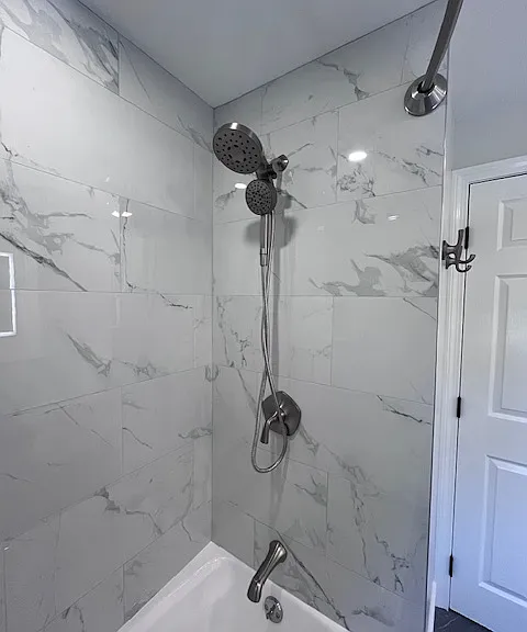 dual head shower & curved curtain rod for additional comfort