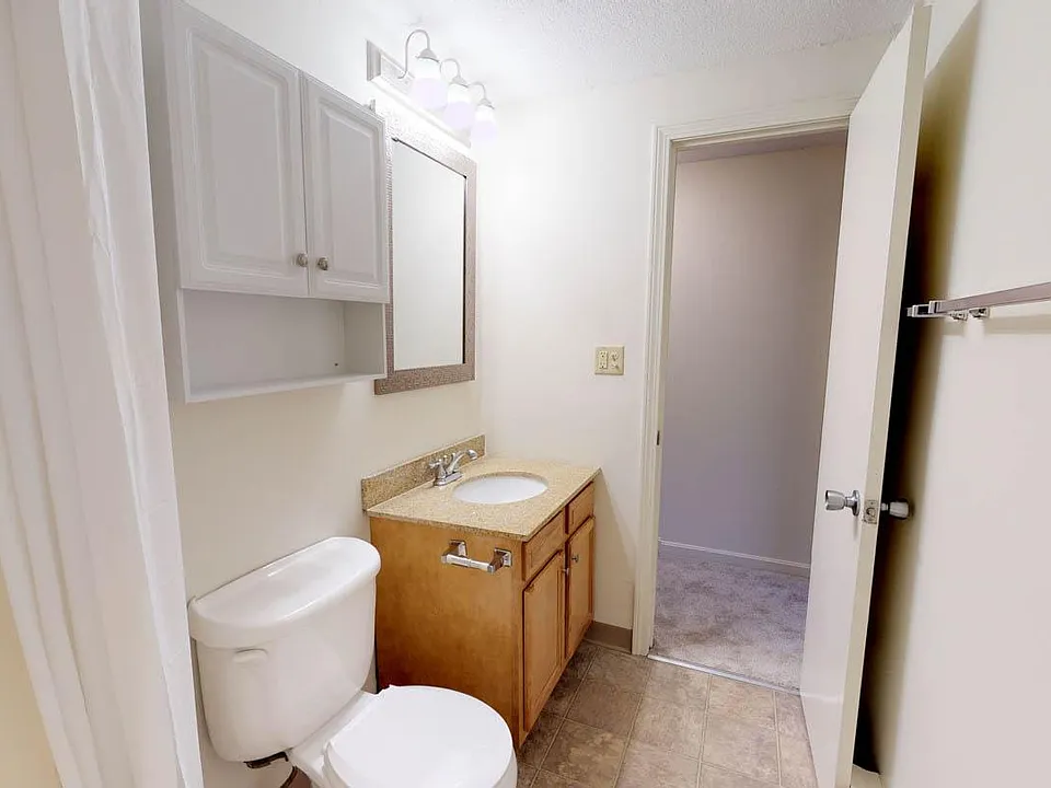 Fresh, bright, modern finishes! custom granite vanities with designer mirror and sleek hardware