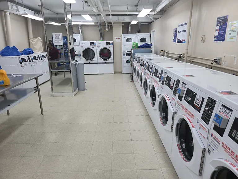 The in-house laundry room boasts all-new washing machines and dryers as of May 2026.