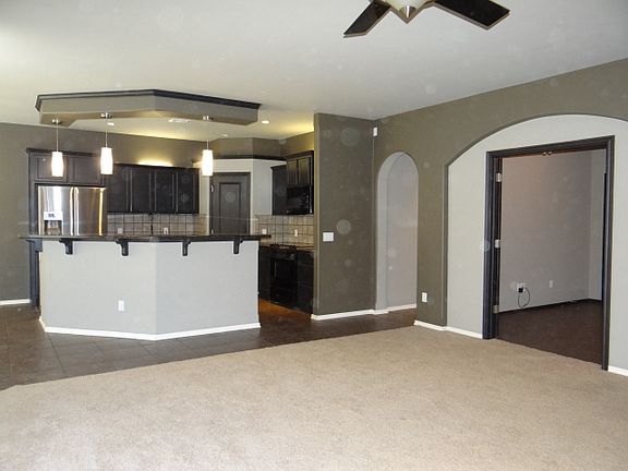 Kitchen opens onto Living Rm