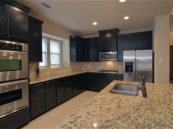 The spacious kitchen has a huge island; great for entertaining.
