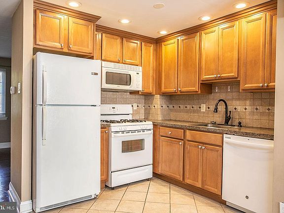 Full kitchen w/microwave, gas oven and range.