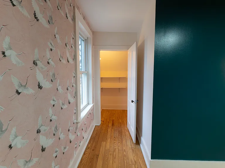 Large closet tucked into the corner of the bedroom for lots of storage space