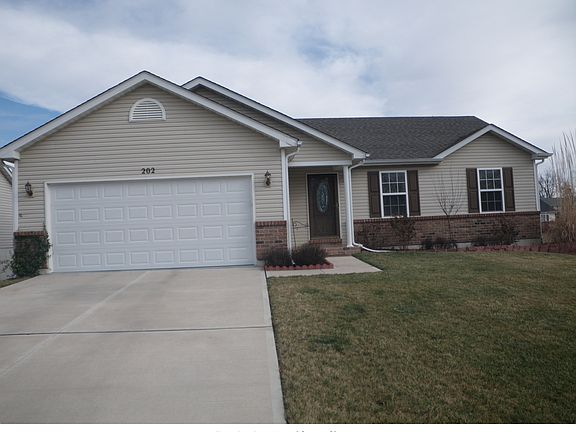 Two Car Garage and front of house.