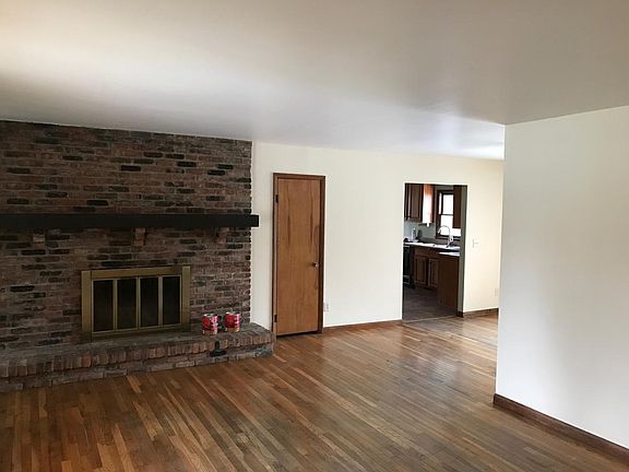Living room view towards dining room and kitchen.