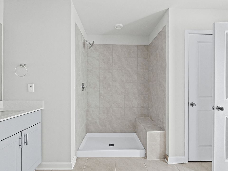 The primary ensuite boasts duel sinks, tile shower and large walk-in closet.