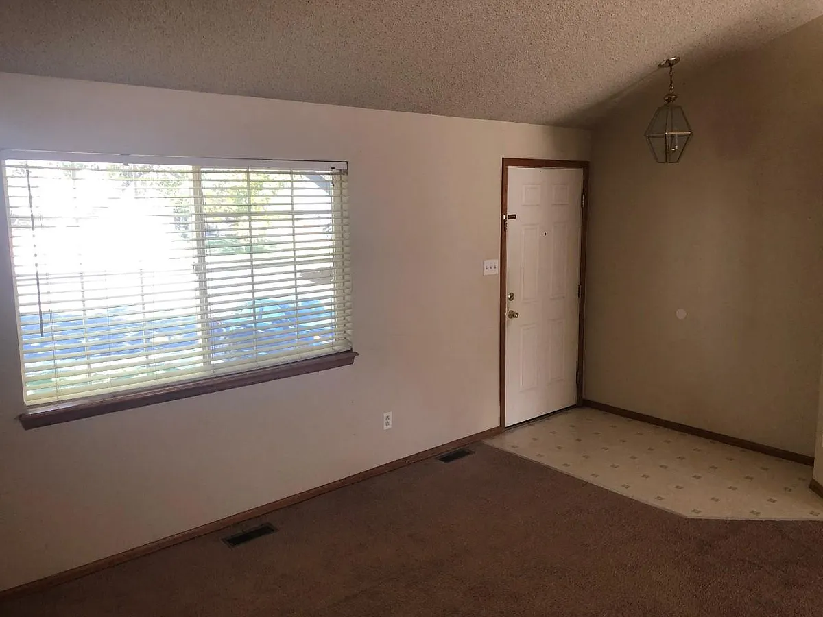 front door and living room - 5360 E 129th Way