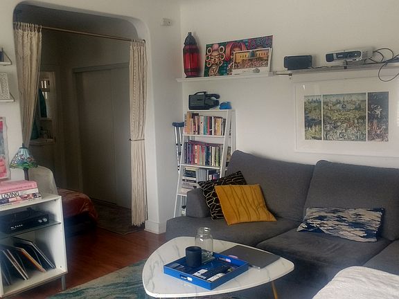 Living area and entry to sleep alcove