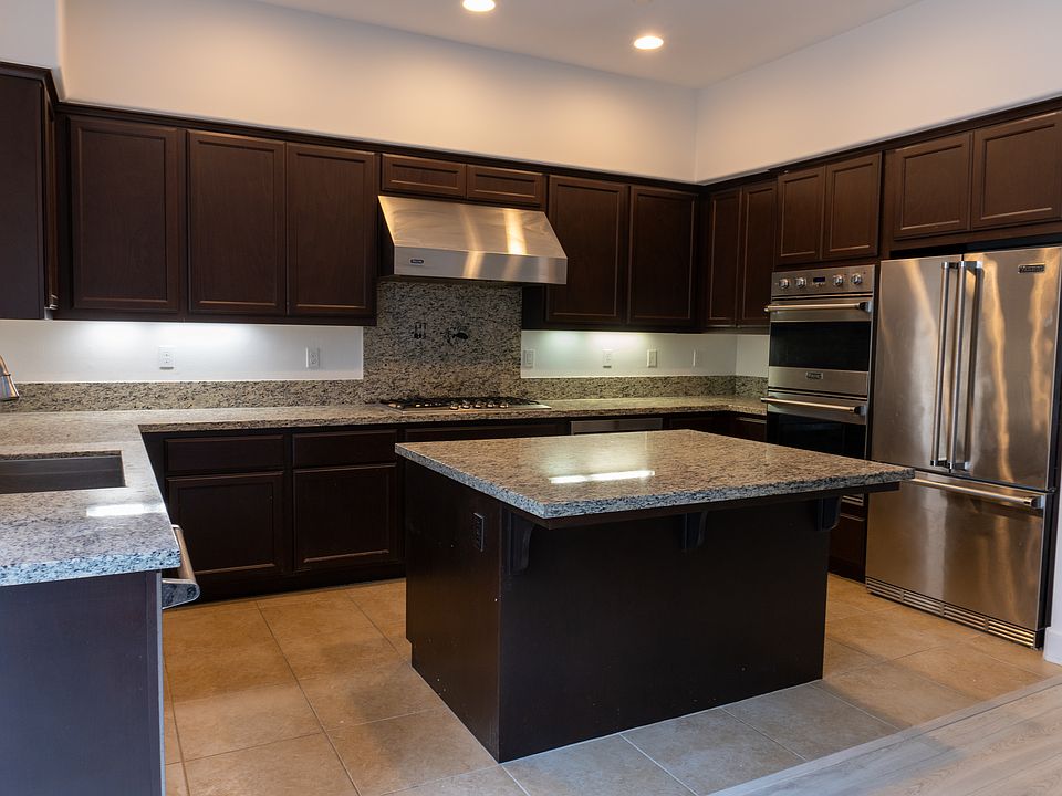 Kitchen with marble countertops and island area