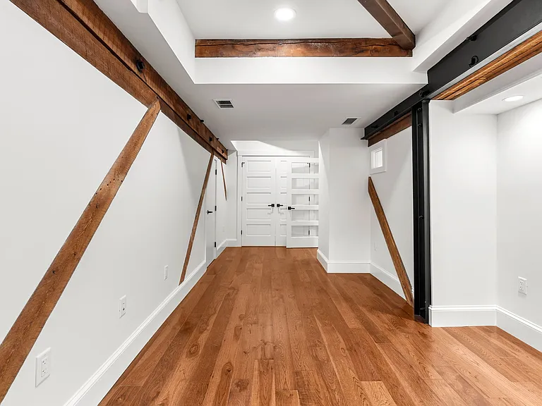 Guest bedroom with exposed beams and on-suite bath with Jacuzzi