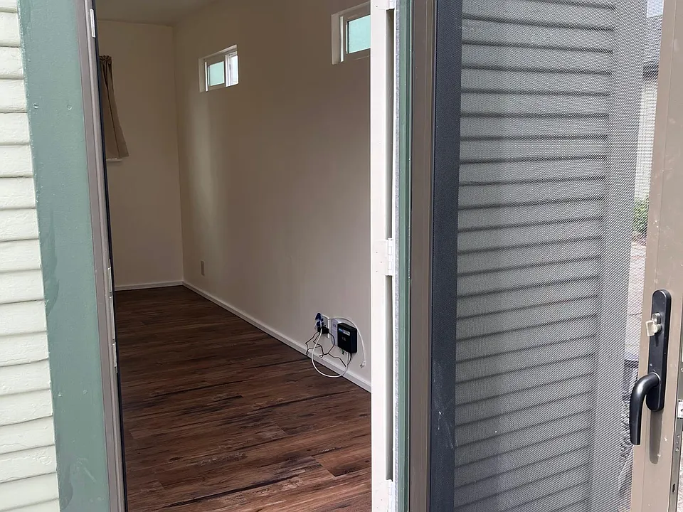 View of entryway and bedroom