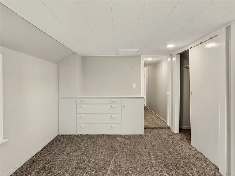 Primary bedroom with built in dresser