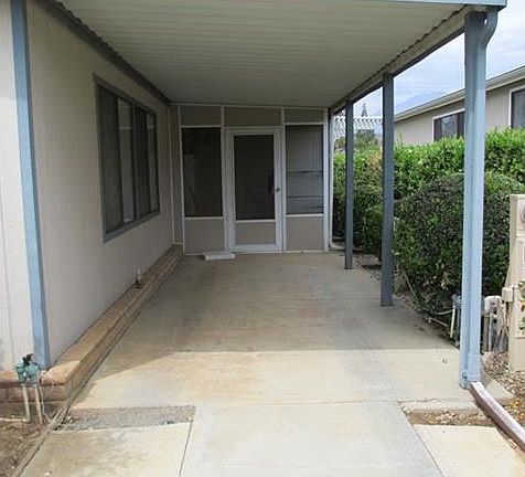 CARPORT TO THE RIGHT OF HOME/SCREENED IN PORCH/BEHIND THAT DAY R