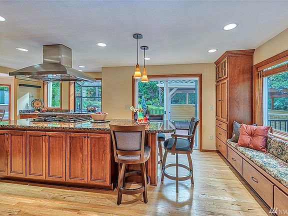 This is the view from the living room into the chef's kitchen. Those 3 chairs are included.