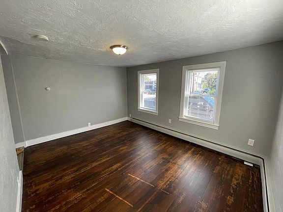 Living Room with Refinished Floors Lots of Natural Light (Front of House)