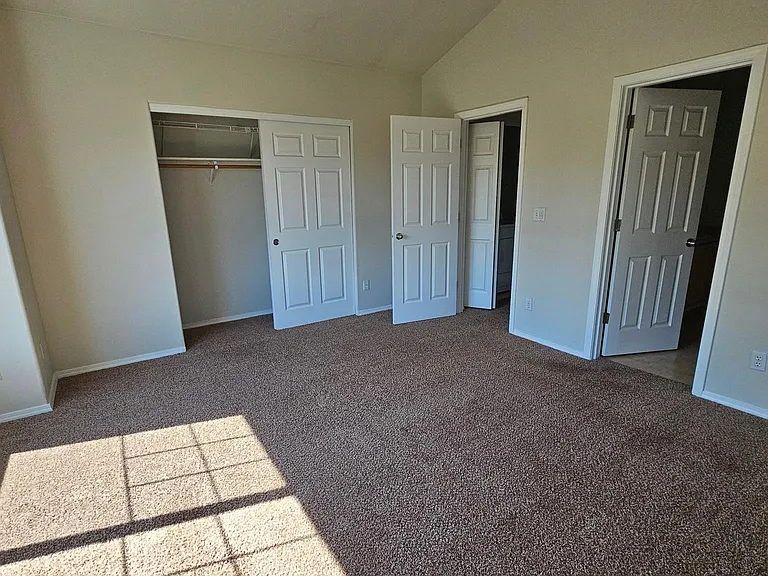 Another view of primary bedroom